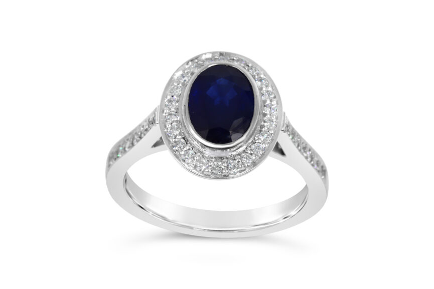OVAL SAPPHIRE SINGLE STONE DIAMOND SURROUND RING