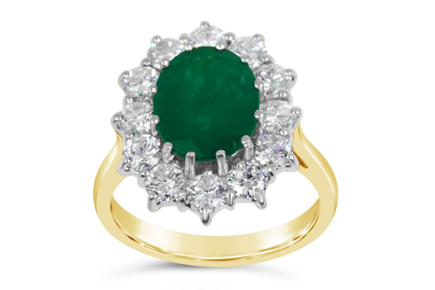 OVAL EMERALD + DIAMOND CLUSTER RING